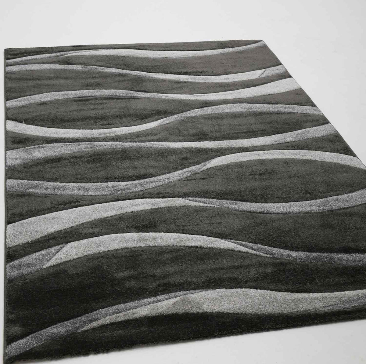 Modern rug with wave pattern, contour cut, for living room in grey, anthracite, brown, and beige