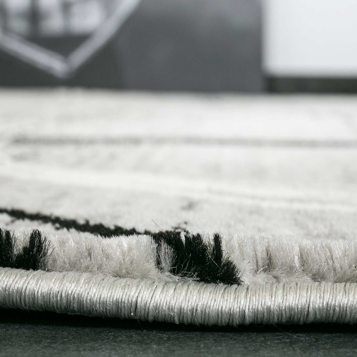 Designer rug, modern swirl pattern, mottled in grey and black-2