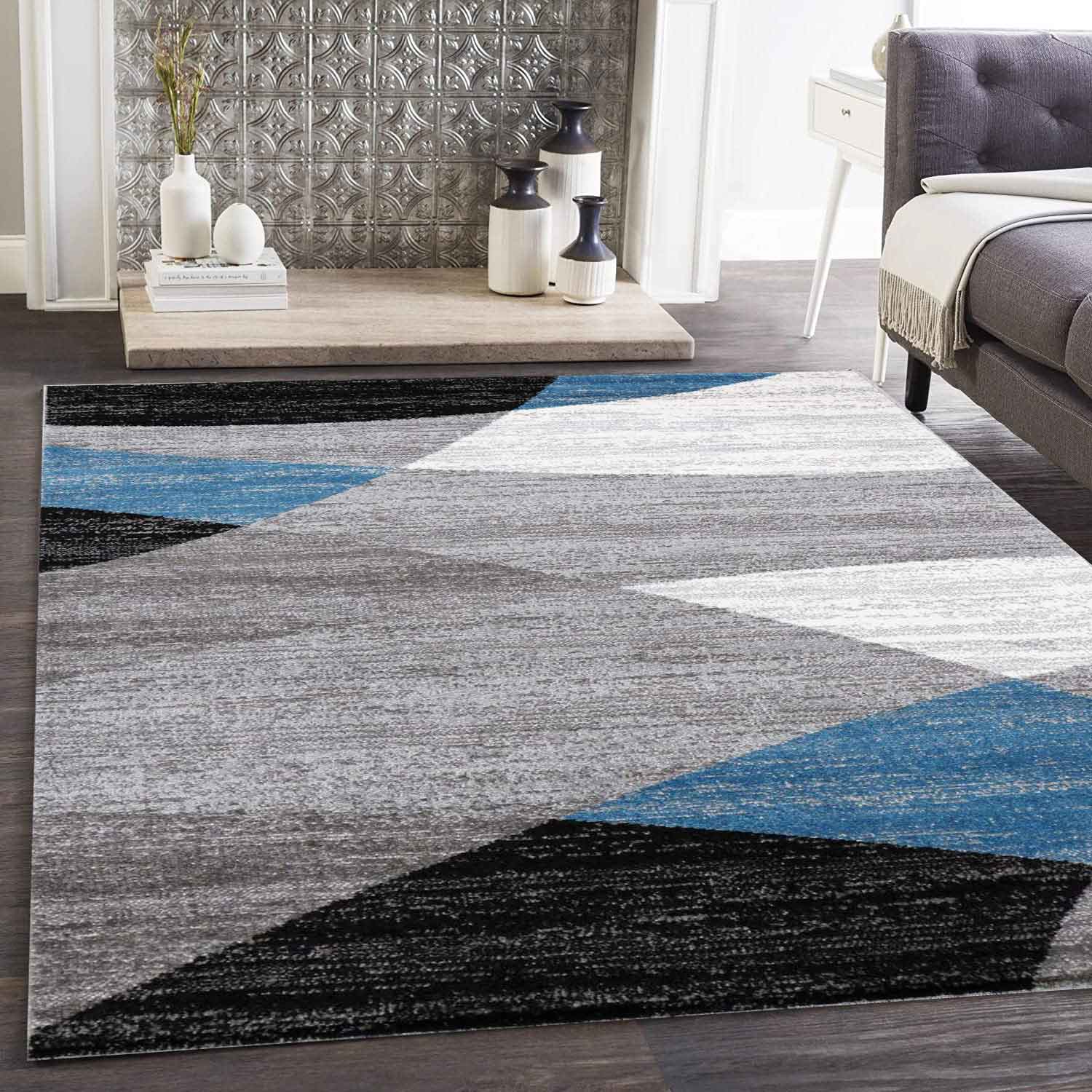 Geometric patterned rug in blue, grey, white, and black, short pile, for living room