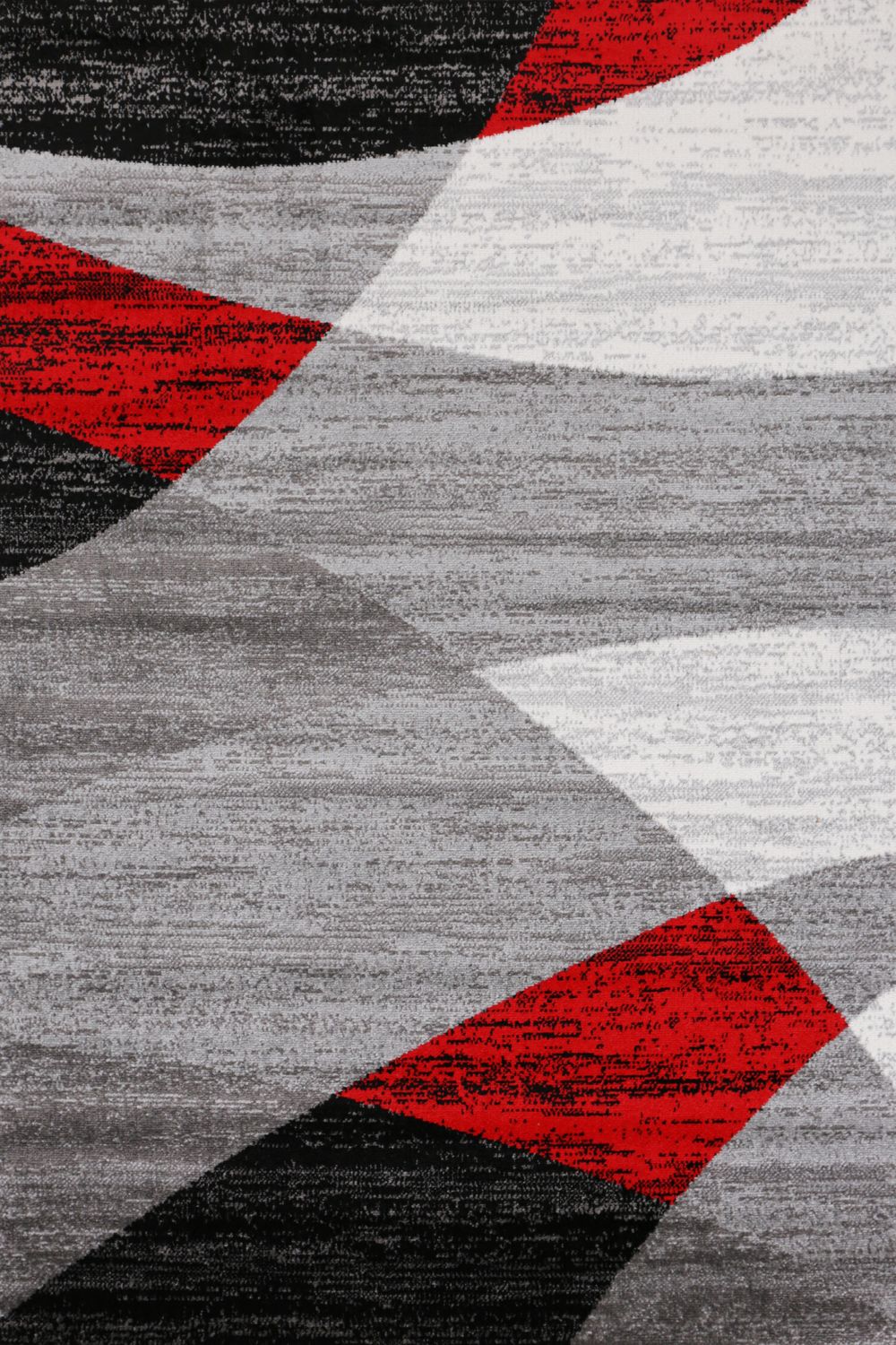 Geometric patterned rug in red, grey, white, and black, short pile, for living room