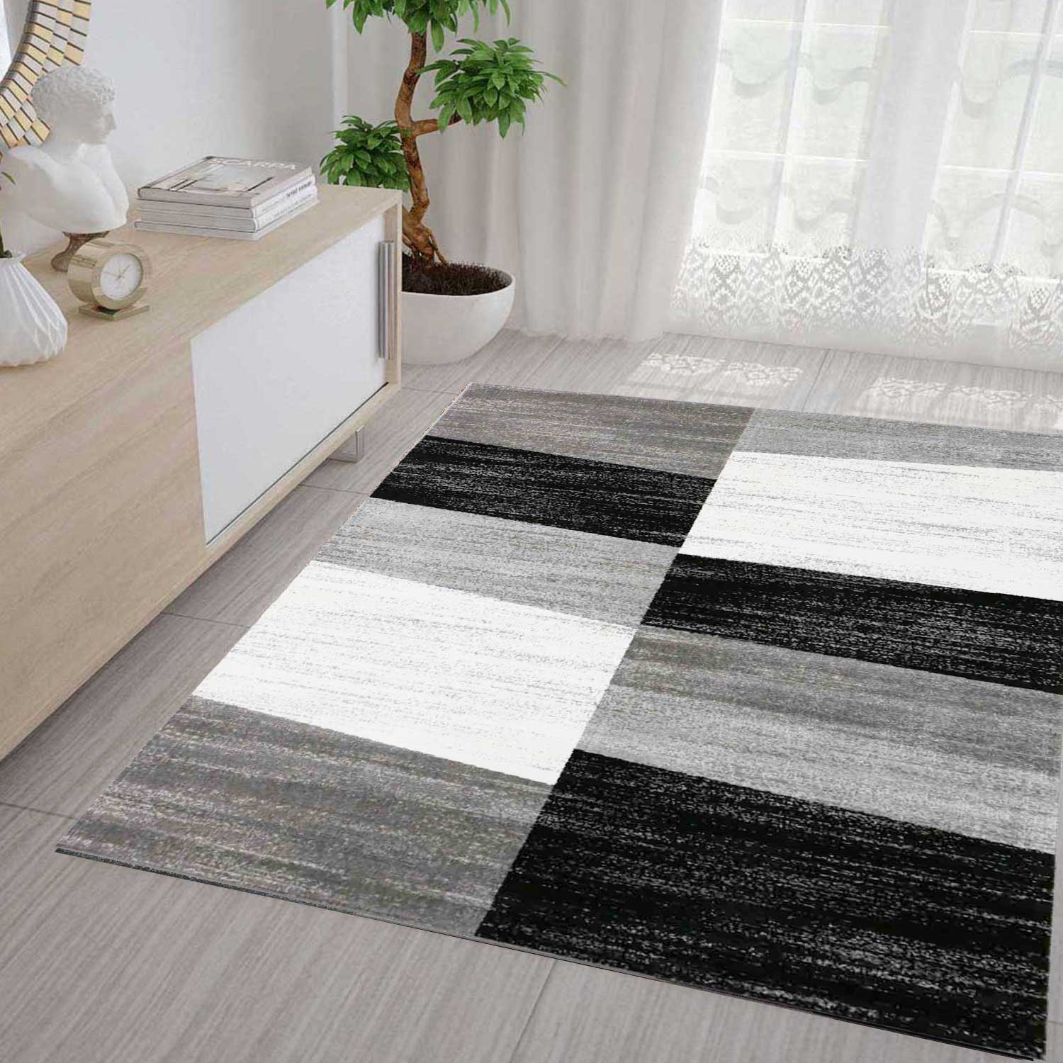 Carpet with geometric tile pattern, mottled checkered in grey, white and black