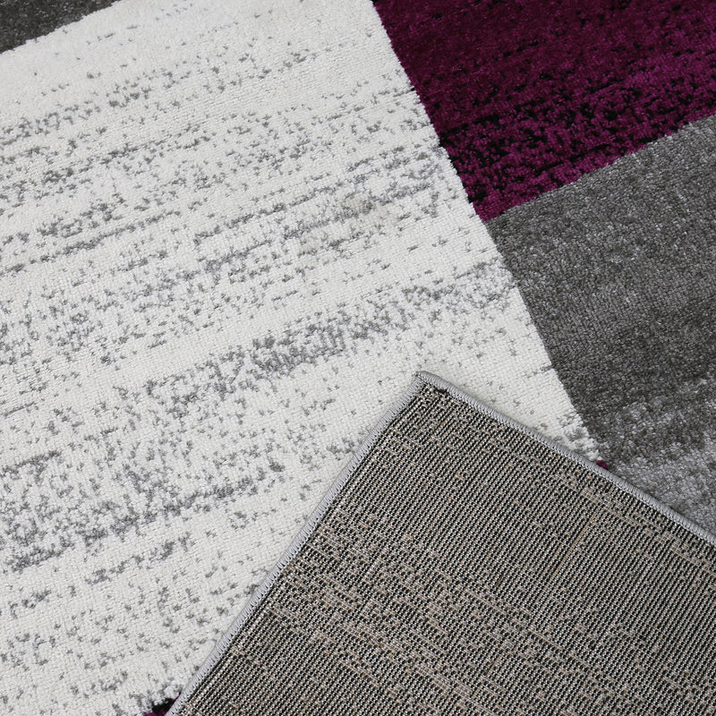 Rug with geometric tile pattern, mottled checkered in purple, grey, white and black-zoom-