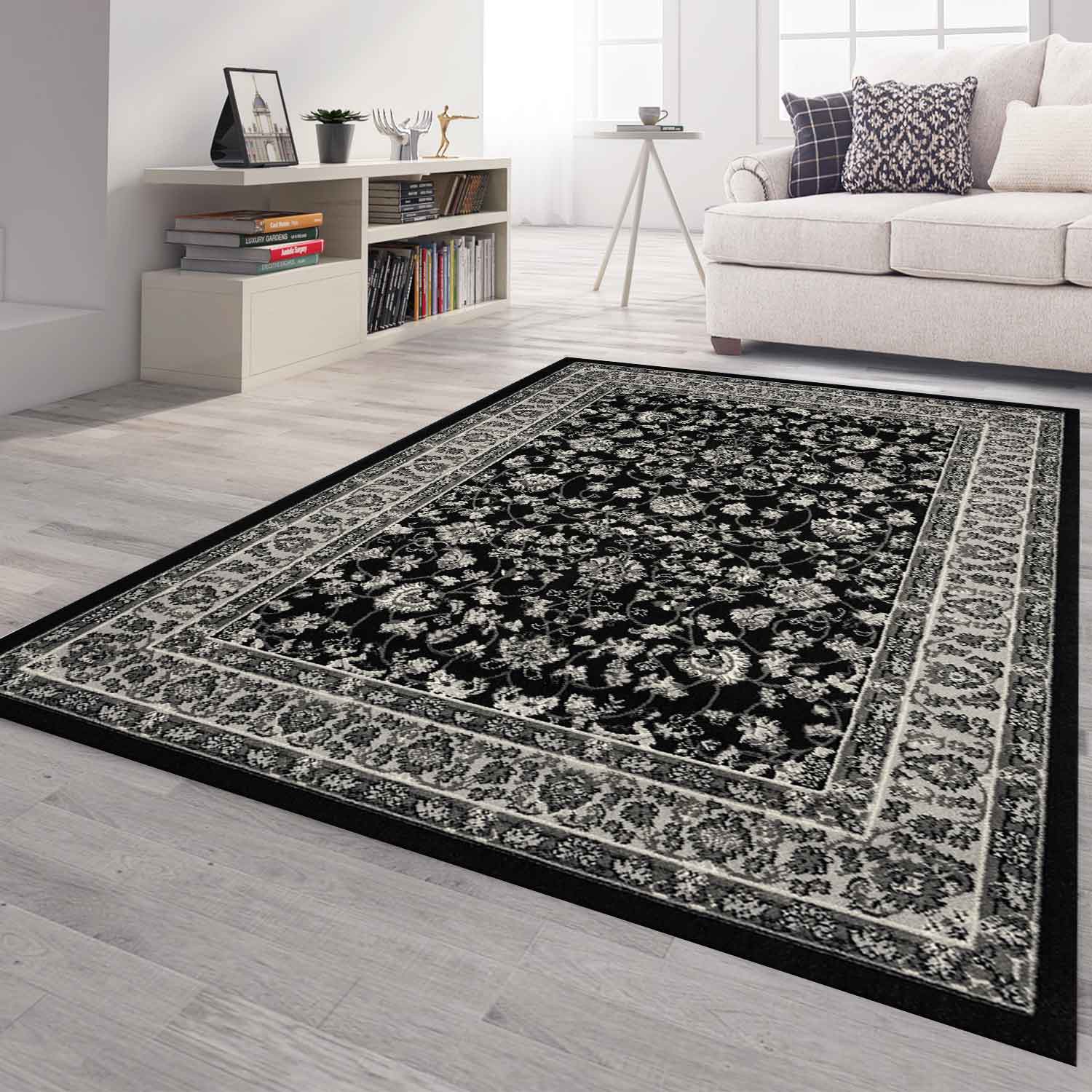 Oriental rug, grey and black, classically densely woven with ornament and floral motifs.-1
