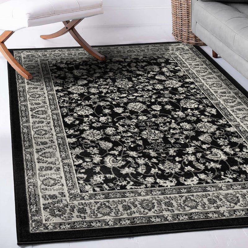 Oriental rug, grey and black, classically densely woven with ornament and floral motifs.-zoom-