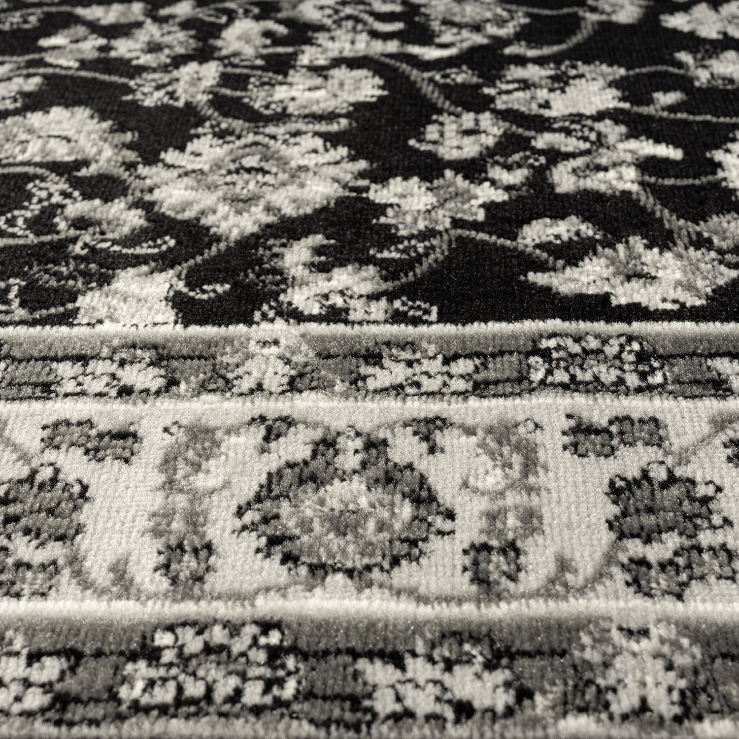 Oriental rug, grey and black, classically densely woven with ornament and floral motifs.-3